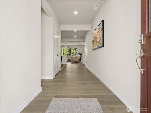 a hallway with a white walls