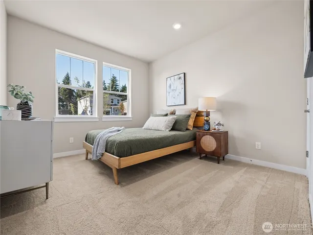 a bedroom with a bed and window