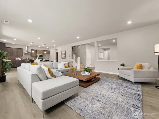 a living room with furniture and a table