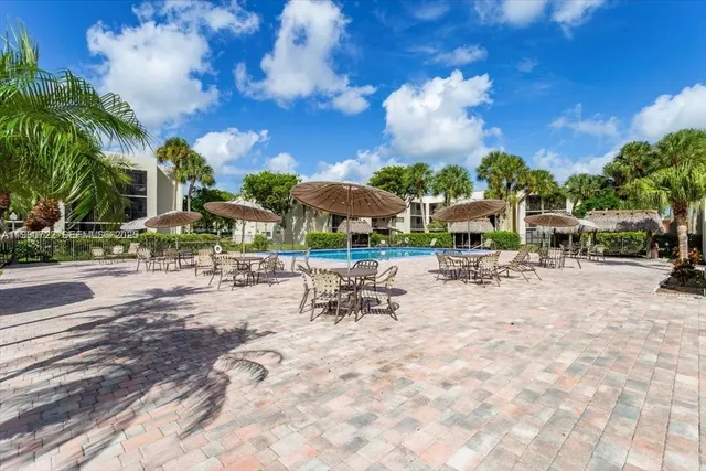 a view of a patio with swimming pool