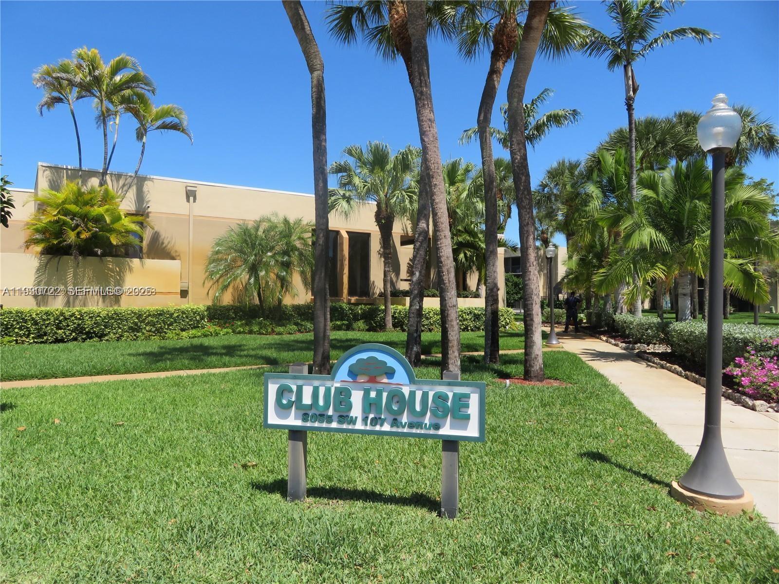 8075 Southwest 107th Avenue, Unit 210 Miami, FL 33173 - Photo 23 of 33 a view of a garden with a bench in patio