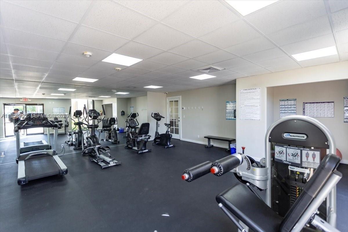 8075 Southwest 107th Avenue, Unit 210 Miami, FL 33173 - Photo 25 of 33 a view of a room with gym equipment