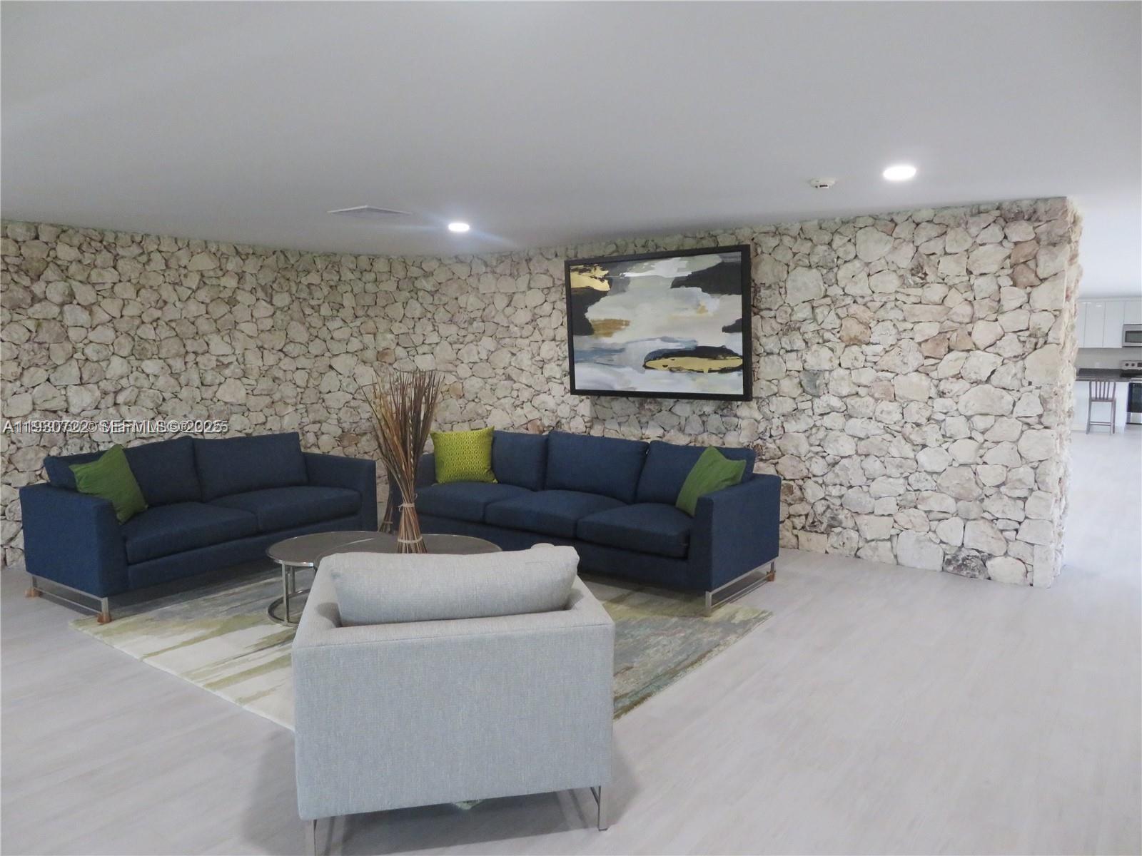 8075 Southwest 107th Avenue, Unit 210 Miami, FL 33173 - Photo 27 of 33 a living room with furniture and a couch