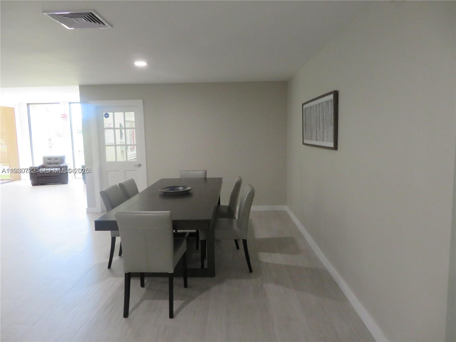 8075 Southwest 107th Avenue, Unit 210 Miami, FL 33173 - Photo 32 of 33 a view of a dining room with furniture