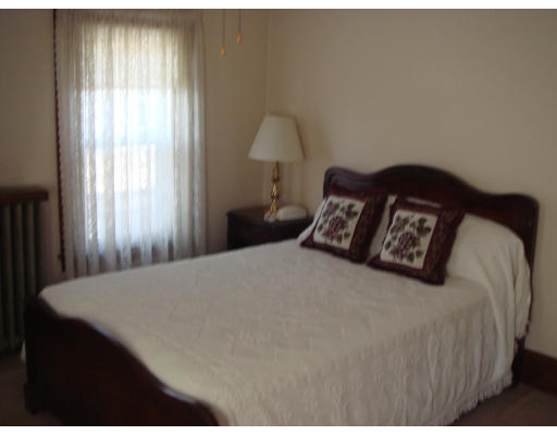 77 Sunapee Street Springfield, MA 01108 - Photo 17 of 28 a bedroom with a bed and a window