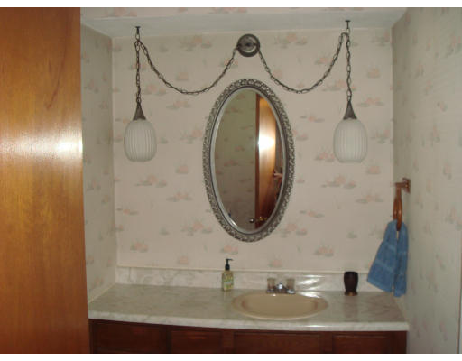 77 Sunapee Street Springfield, MA 01108 - Photo 23 of 28 a bathroom with a sink and a mirror