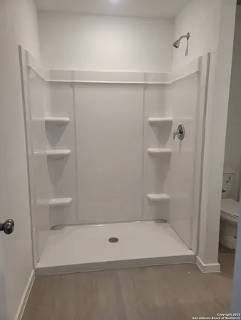 a view of an empty walk in closet