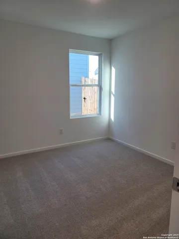 an empty room that has a window
