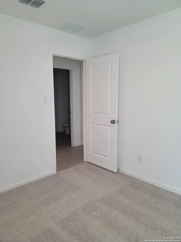 a bathroom with a bathtub and a toilet