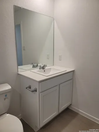 a view of an empty room and closet area