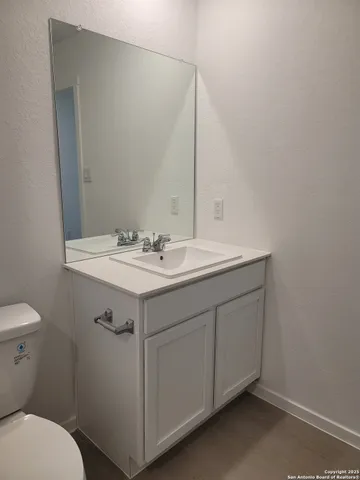 a view of an empty room and closet area