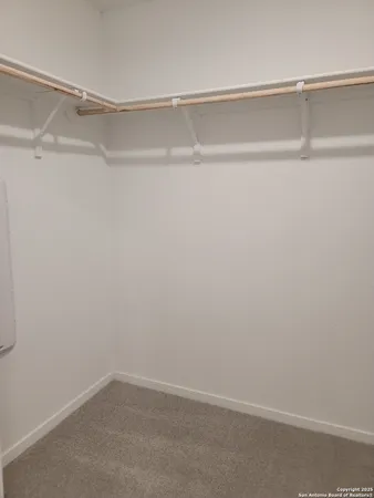 a view of an empty walk in closet