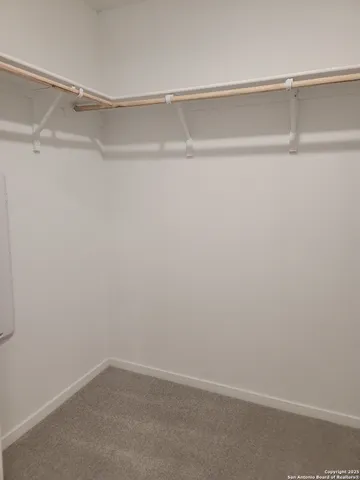 a view of an empty walk in closet