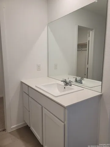 a bathroom with a sink and a mirror