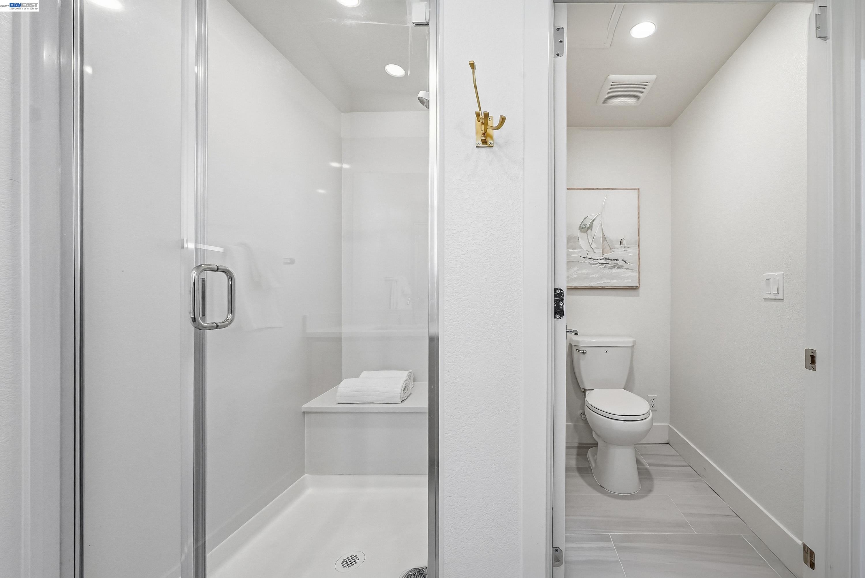 9620 Seawind Way Newark, CA 94560 - Photo 14 of 55 a bathroom with a toilet and a shower