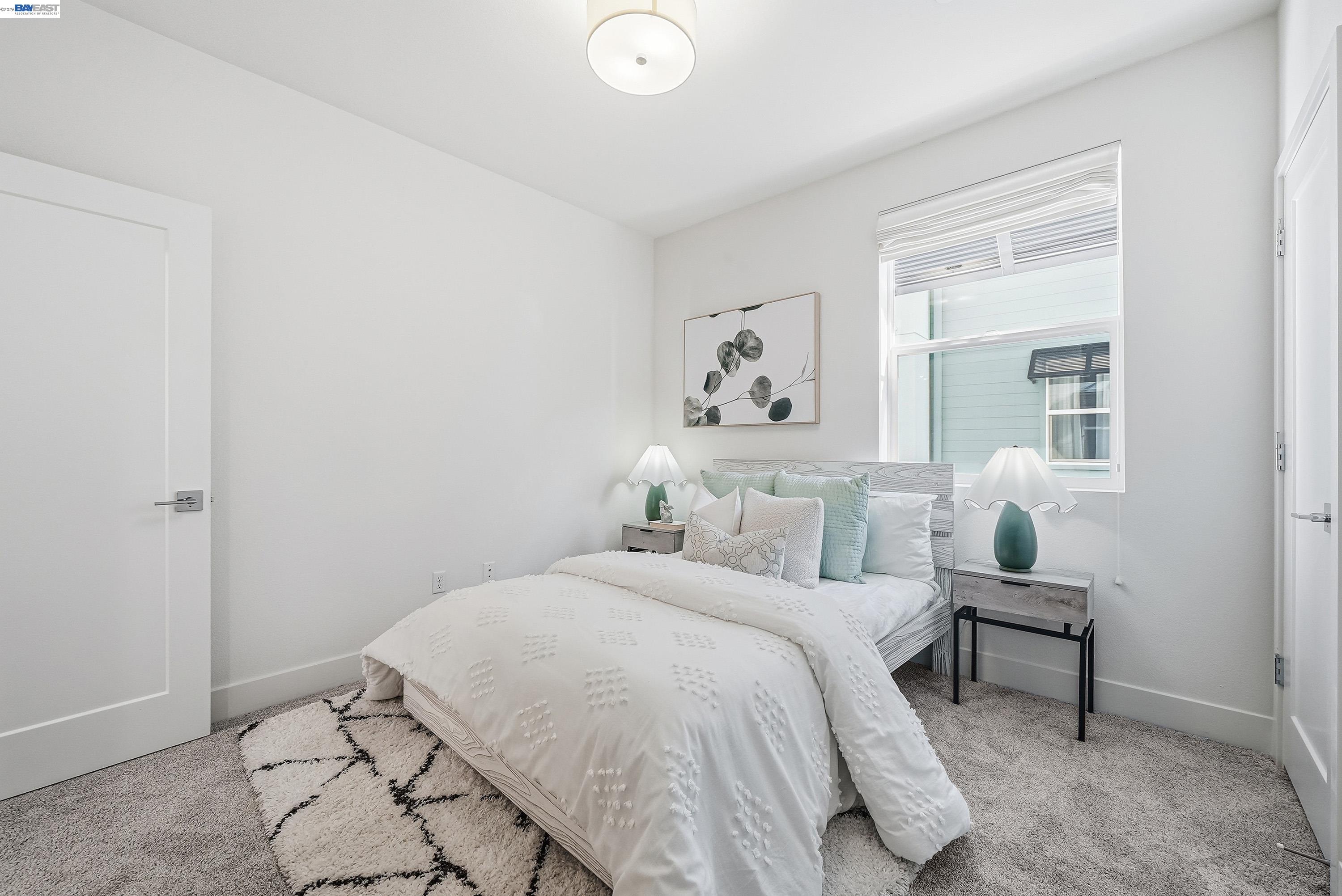 9620 Seawind Way Newark, CA 94560 - Photo 17 of 55 a bedroom with a bed and painting on the wall