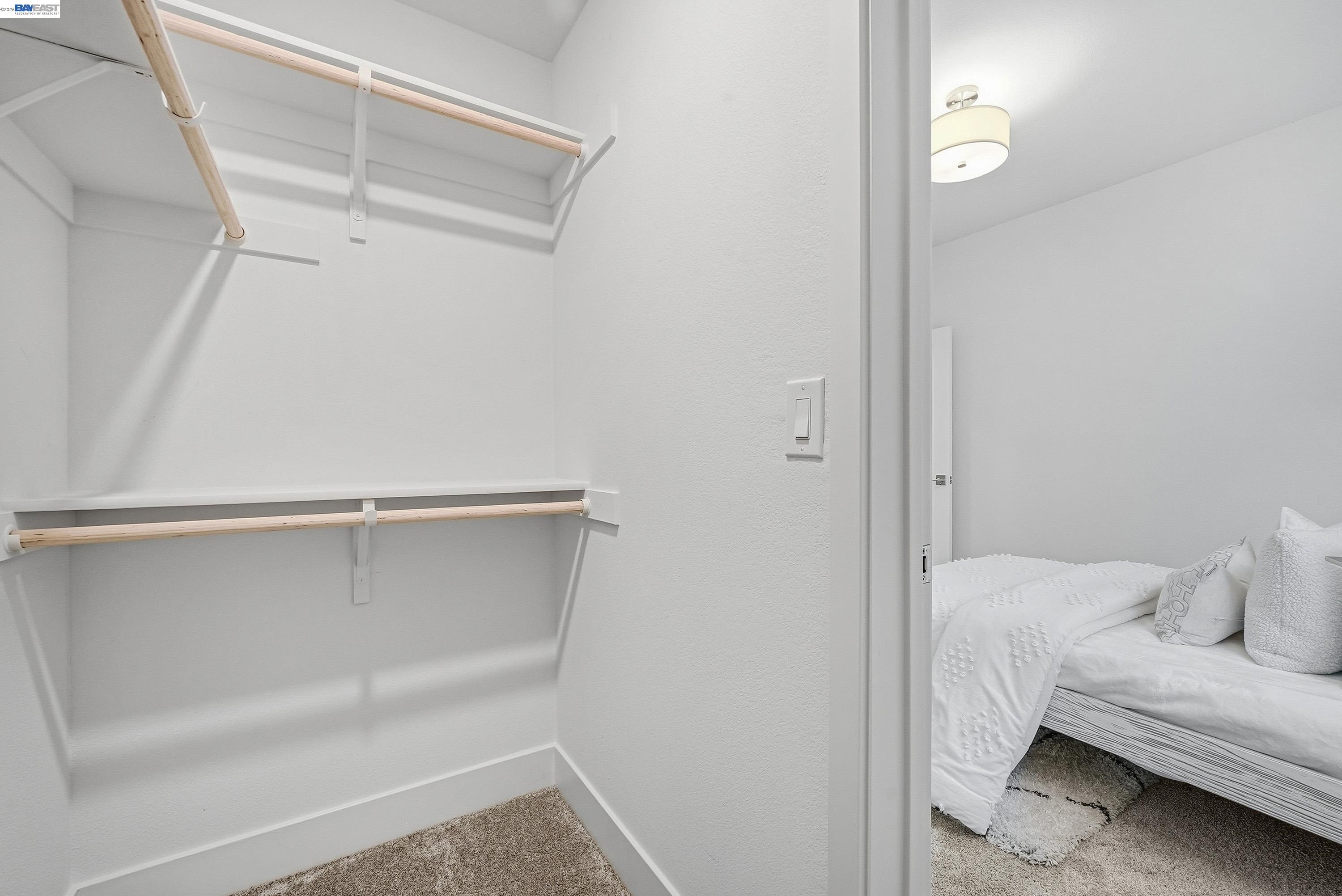 9620 Seawind Way Newark, CA 94560 - Photo 19 of 55 a view of a room with racks on the wall