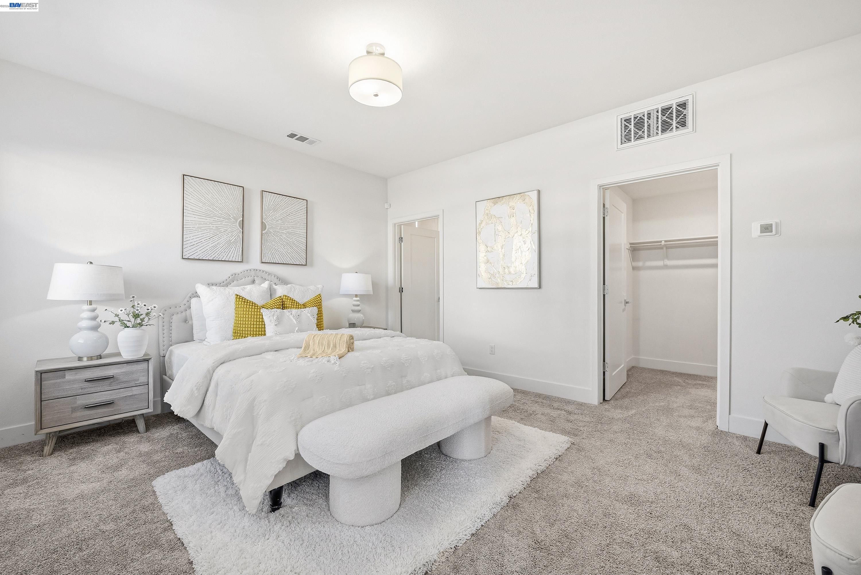 9620 Seawind Way Newark, CA 94560 - Photo 23 of 55 a bedroom with a bed and a lamp