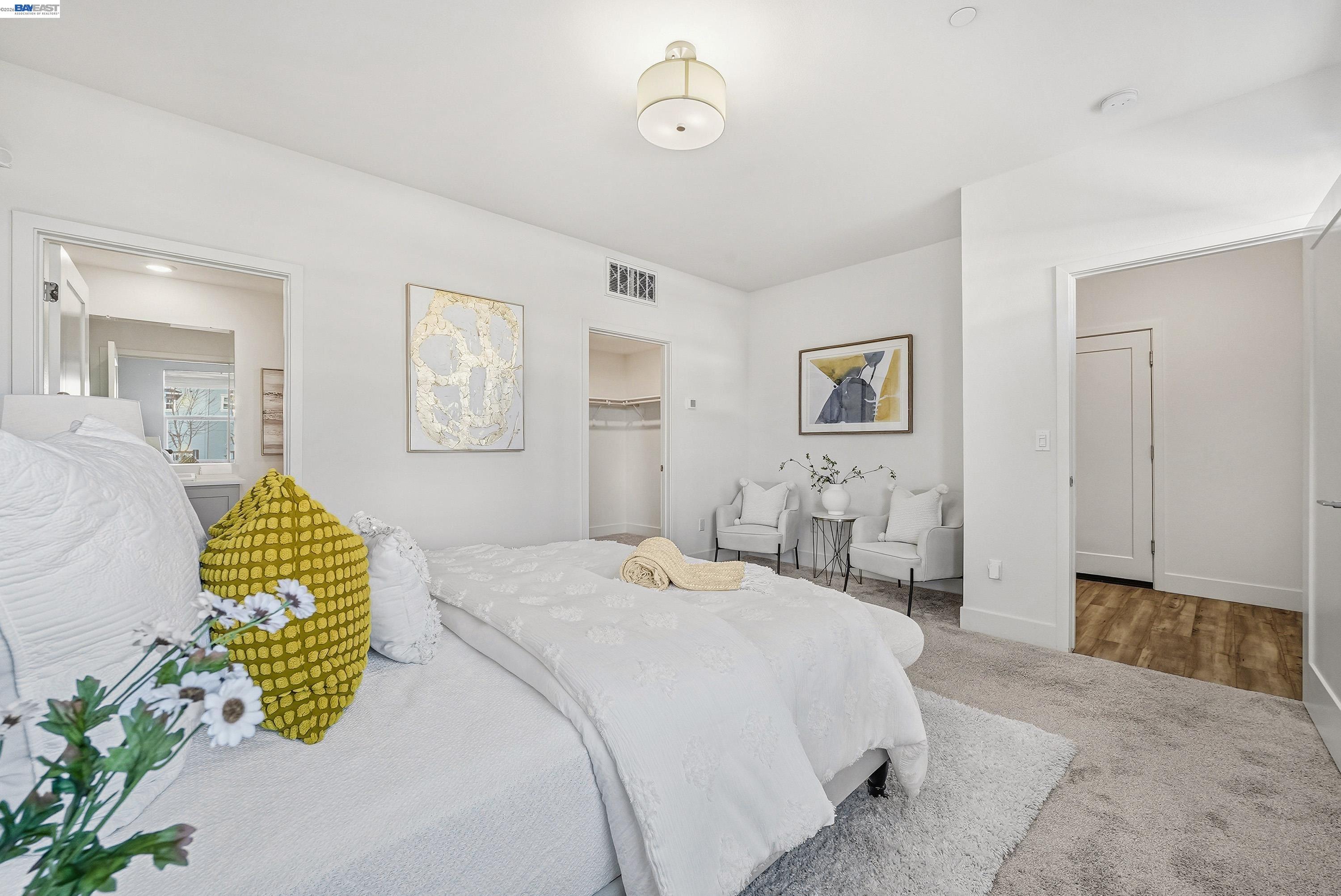 9620 Seawind Way Newark, CA 94560 - Photo 26 of 55 a bedroom with a bed and a chandelier