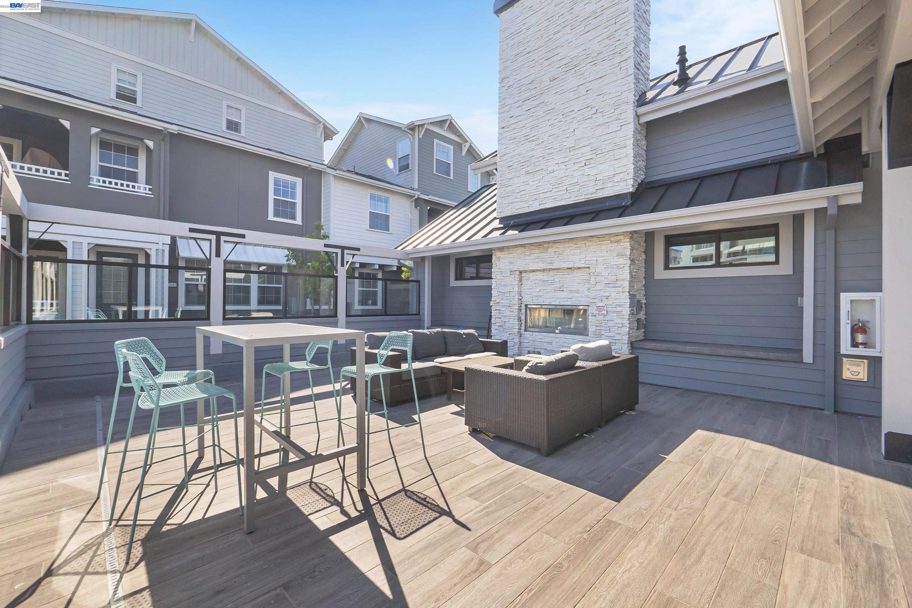 9620 Seawind Way Newark, CA 94560 - Photo 40 of 55 a view of a patio with couches table and chairs and potted plants