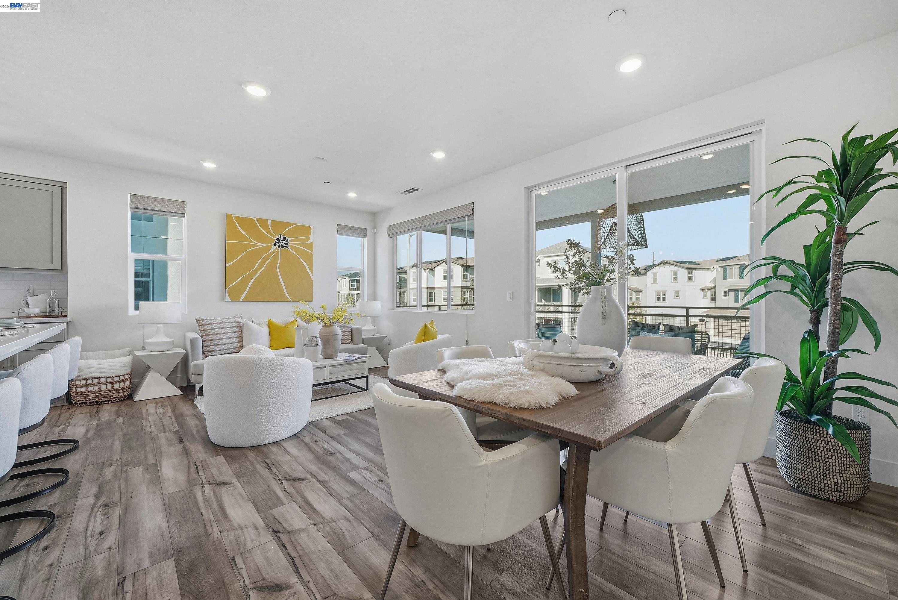 9620 Seawind Way Newark, CA 94560 - Photo 4 of 55 a dining room with furniture a potted plant and open kitchen view