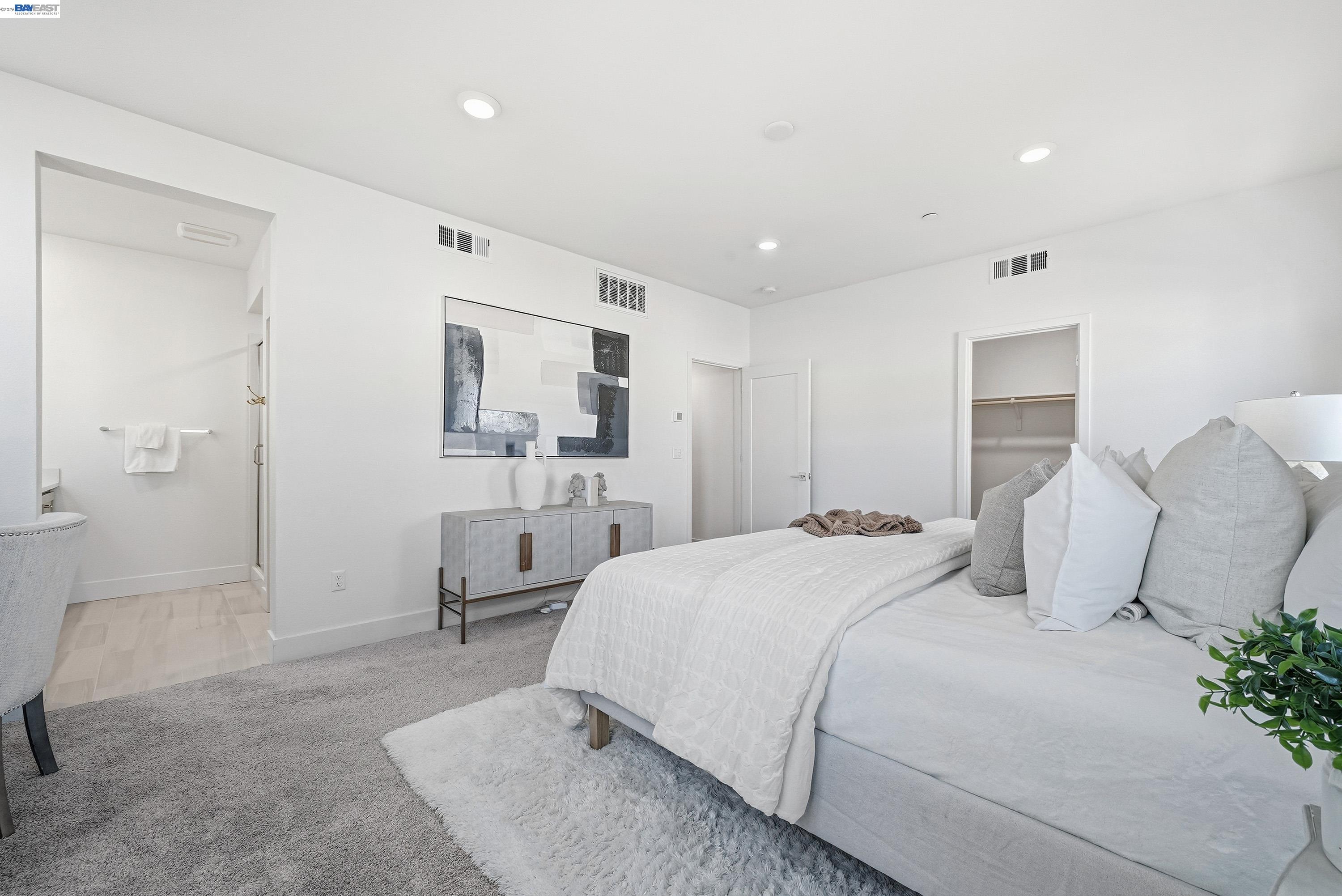 9620 Seawind Way Newark, CA 94560 - Photo 10 of 55 a bedroom with a bed and a couch