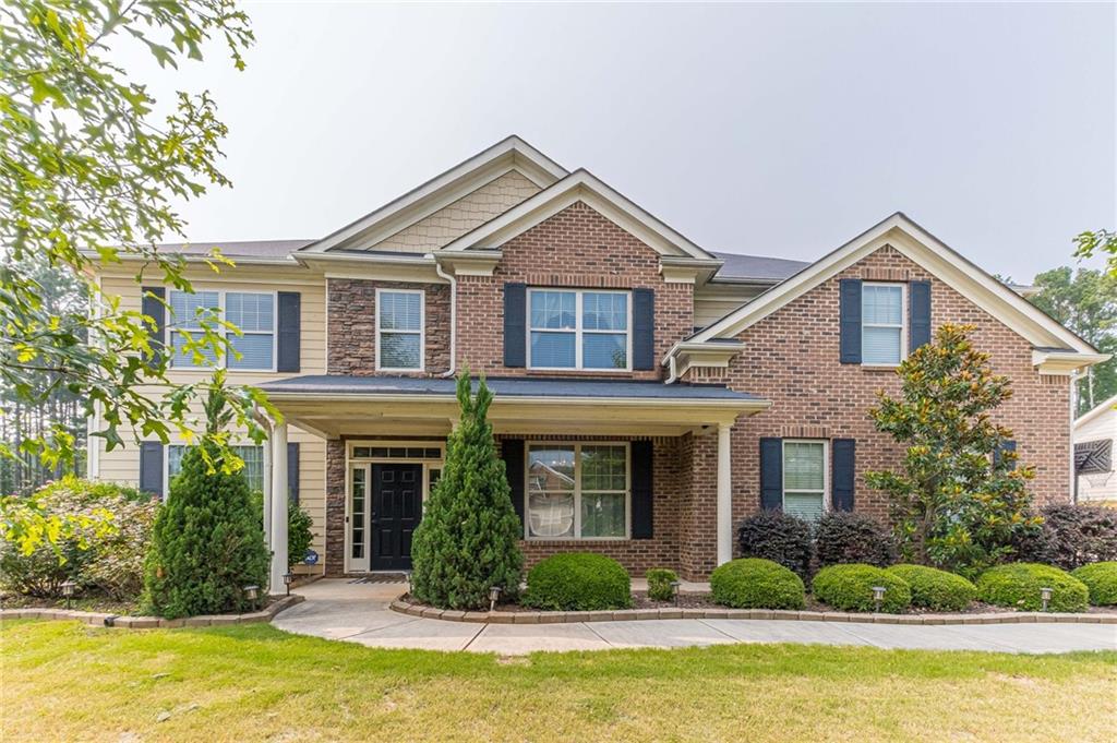 6430 Old Mill Lane Monroe, GA 30655 - Photo 1 of 1 a front view of a house with swimming pool and glass windows