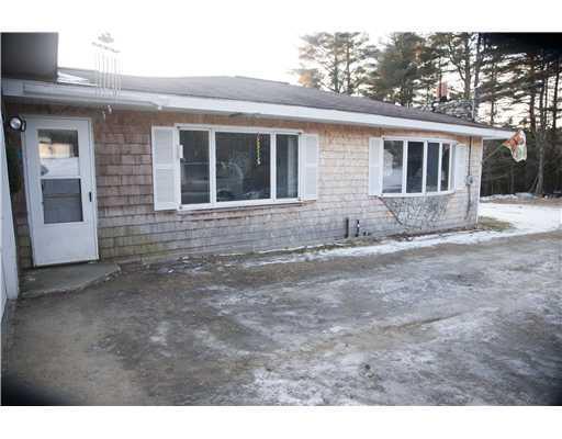 243 Bobcat Road Clifton, ME 04428 - Photo 13 of 25 Exterior Front. Side yard entry way