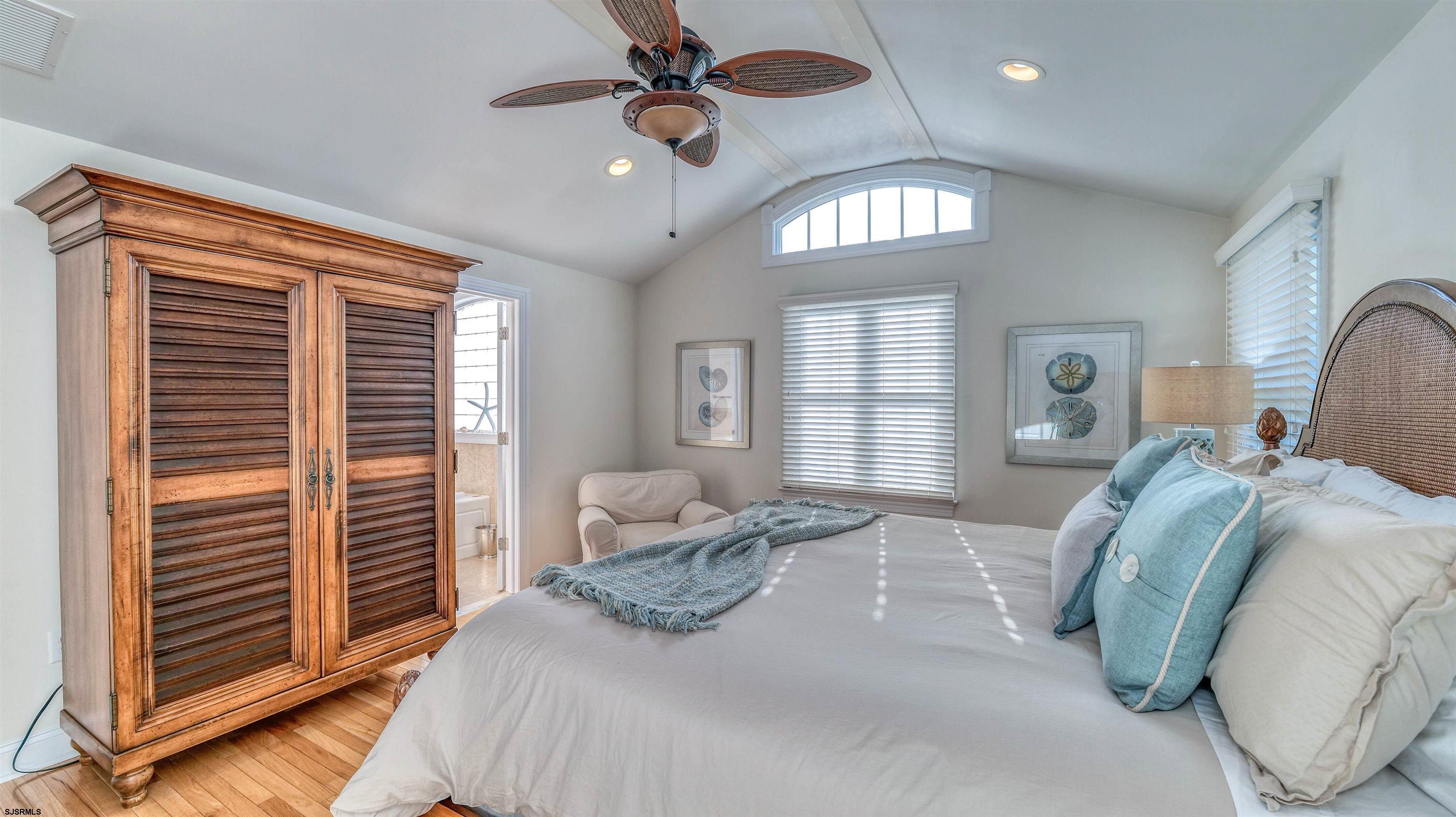 119 North Belmont Avenue, Unit AUGUST LABOR DAY Margate City, NJ 08402 - Photo 17 of 35 a bedroom with a bed next to a window