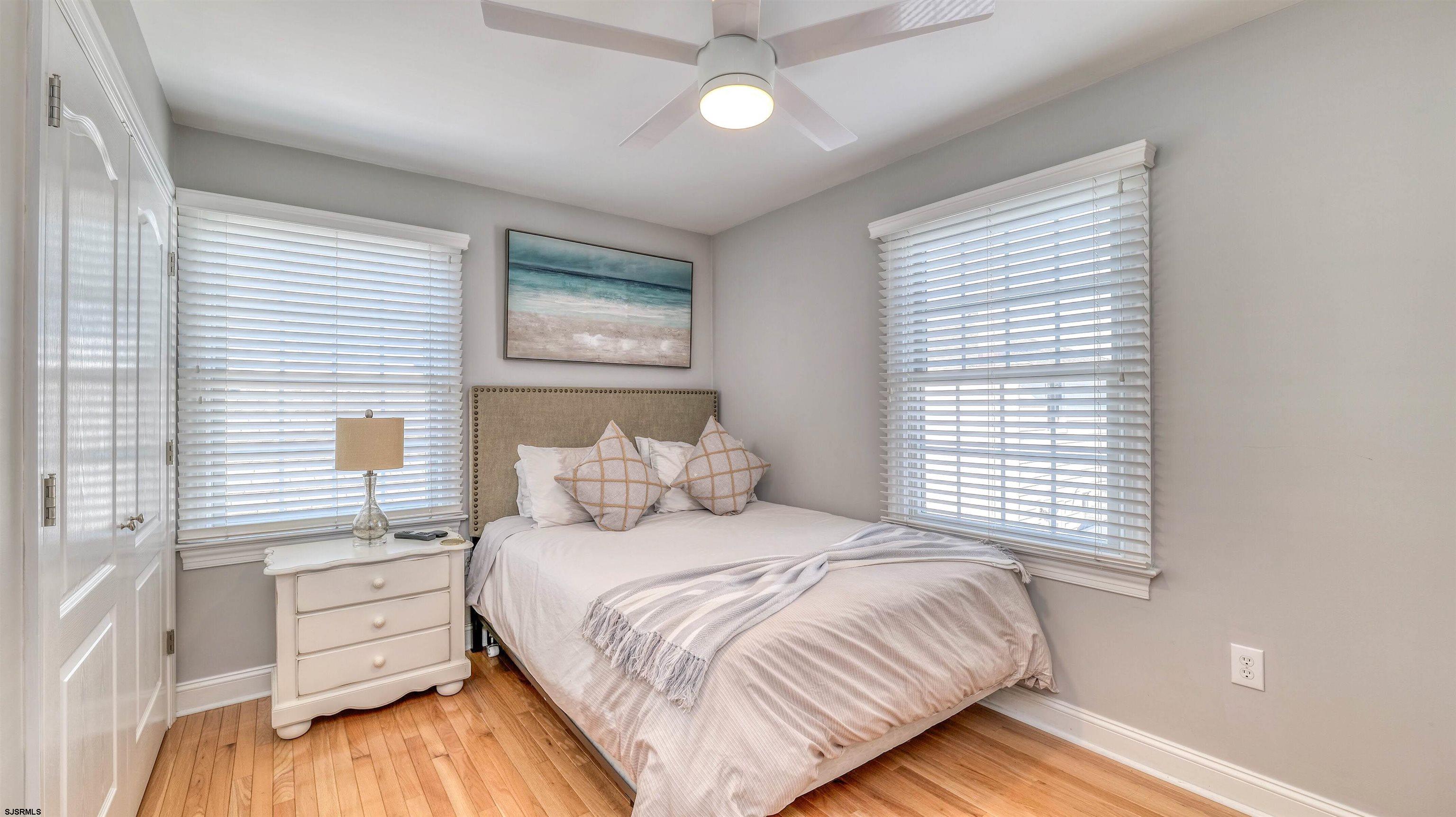 119 North Belmont Avenue, Unit AUGUST LABOR DAY Margate City, NJ 08402 - Photo 22 of 35 a bedroom with a bed and a window