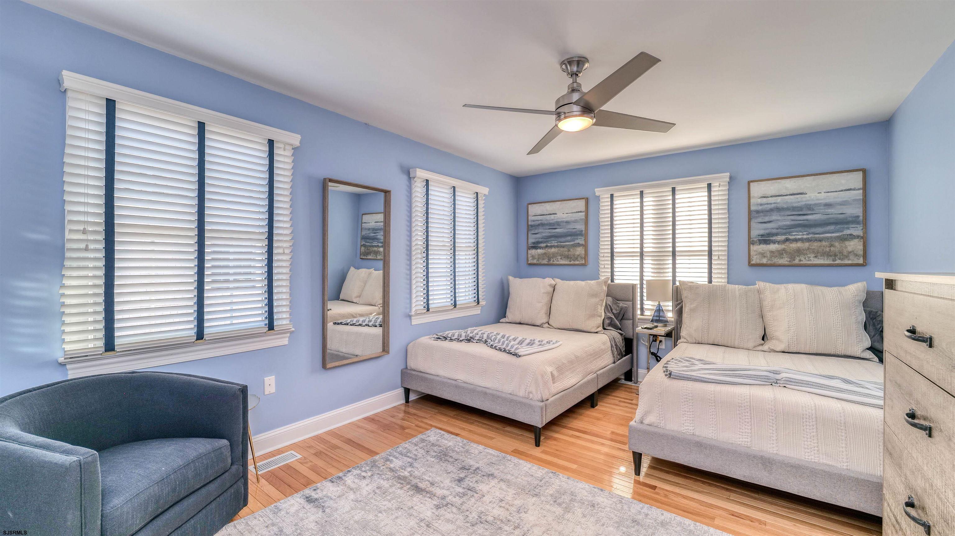 119 North Belmont Avenue, Unit AUGUST LABOR DAY Margate City, NJ 08402 - Photo 26 of 35 a living room with furniture and a large window
