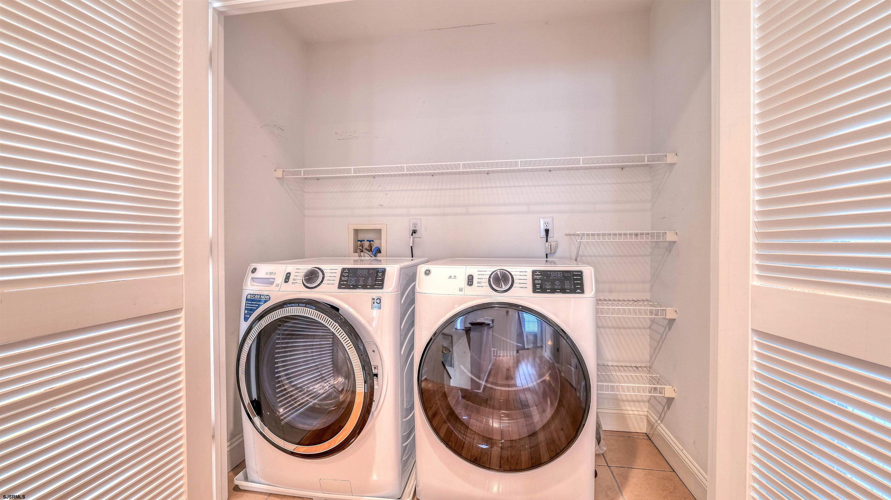 119 North Belmont Avenue, Unit AUGUST LABOR DAY Margate City, NJ 08402 - Photo 27 of 35 a utility room with dryer and washer