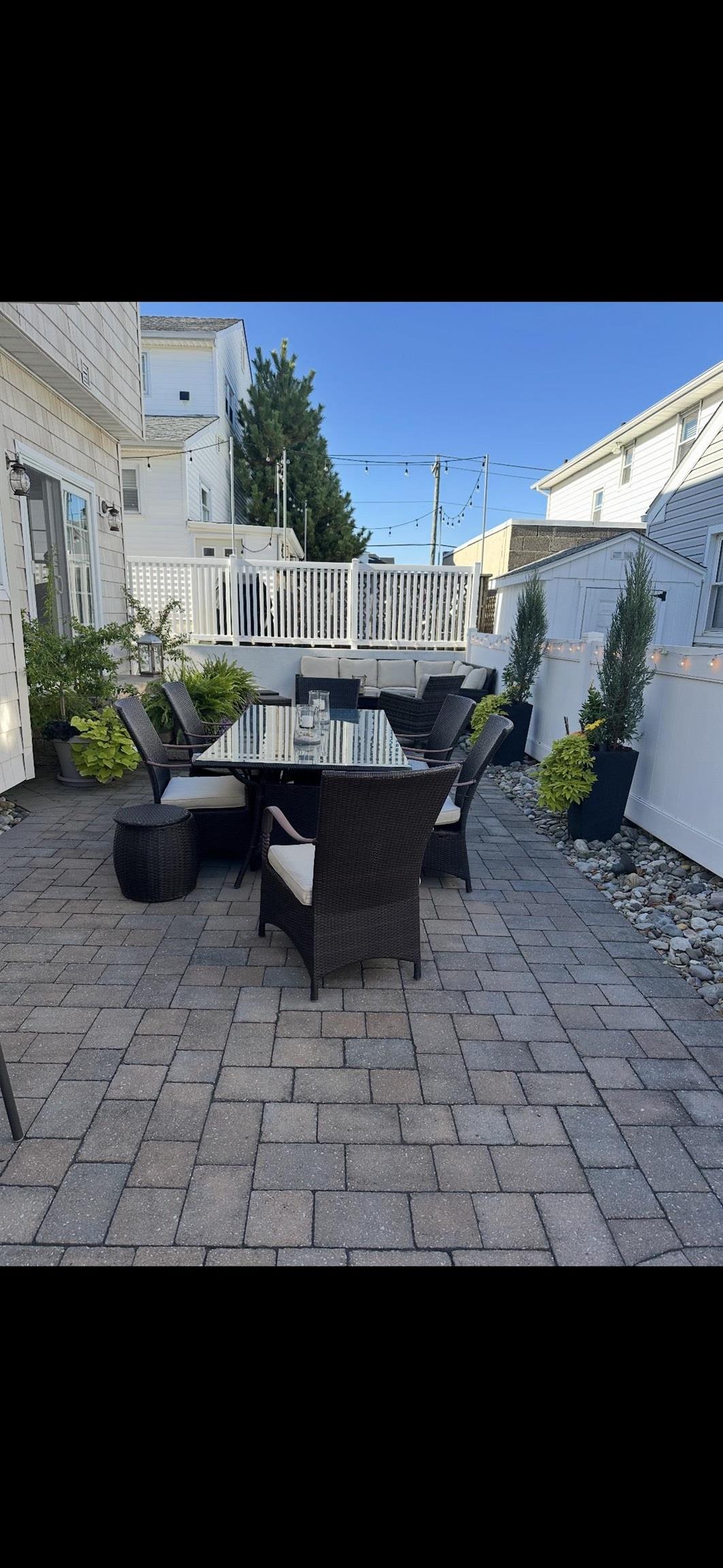 119 North Belmont Avenue, Unit AUGUST LABOR DAY Margate City, NJ 08402 - Photo 30 of 35 a view of a patio with couches and potted plants