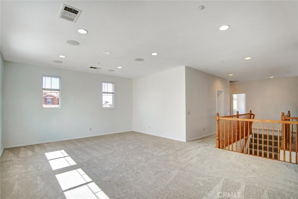 9350 Dauchy Avenue Riverside, CA 92508 - Photo 18 of 34 Versatility at its finest. This massive upstairs loft provides the perfect secondary living space, home theater, or virtual learning center, offering that essential extra 'zone' for a growing household.