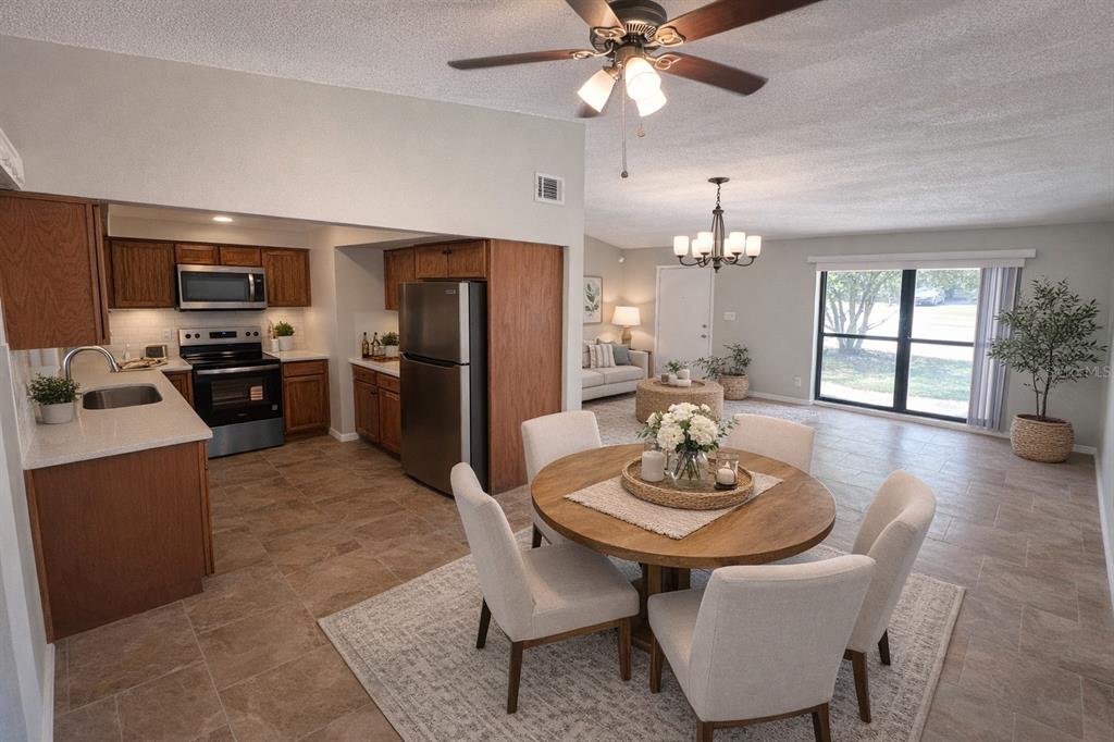 3823 Pine Ridge Road Orlando, FL 32808 - Photo 3 of 13 a view of a dining room with furniture