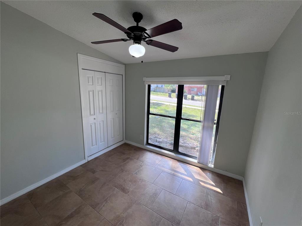 3823 Pine Ridge Road Orlando, FL 32808 - Photo 7 of 13 a view of an empty room with a window