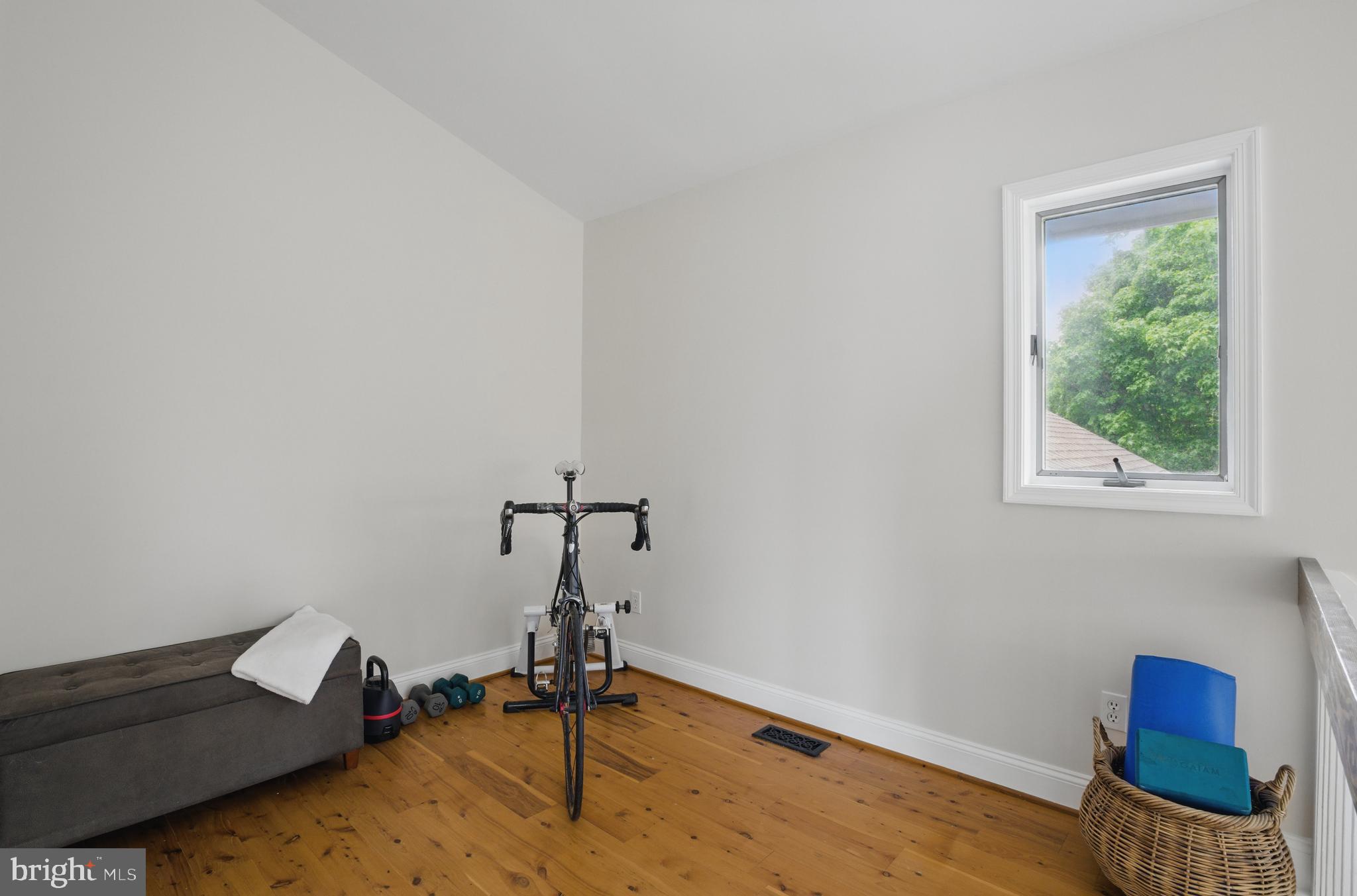 2921 Cox Neck Road East Chester, MD 21619 - Photo 25 of 66 a room with gym equipment and a window