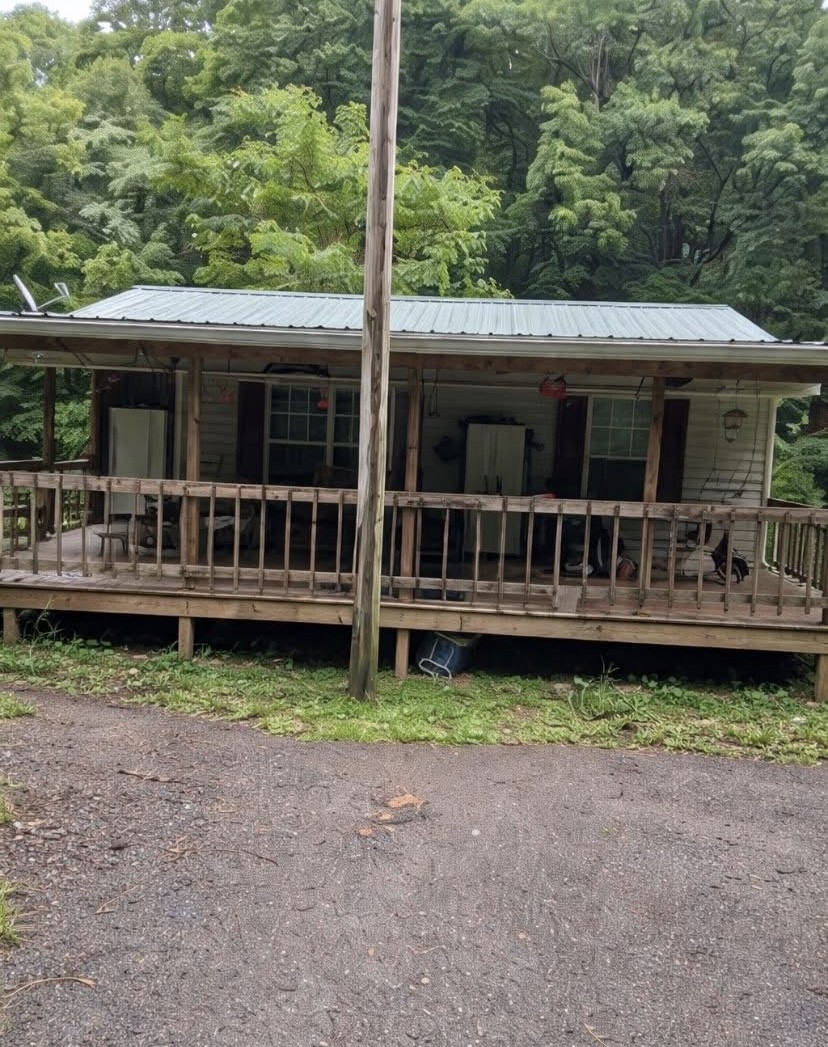 2750 Lyle Hollow Road Palmyra, TN 37142 - Photo 1 of 9 a view of house with a yard and deck