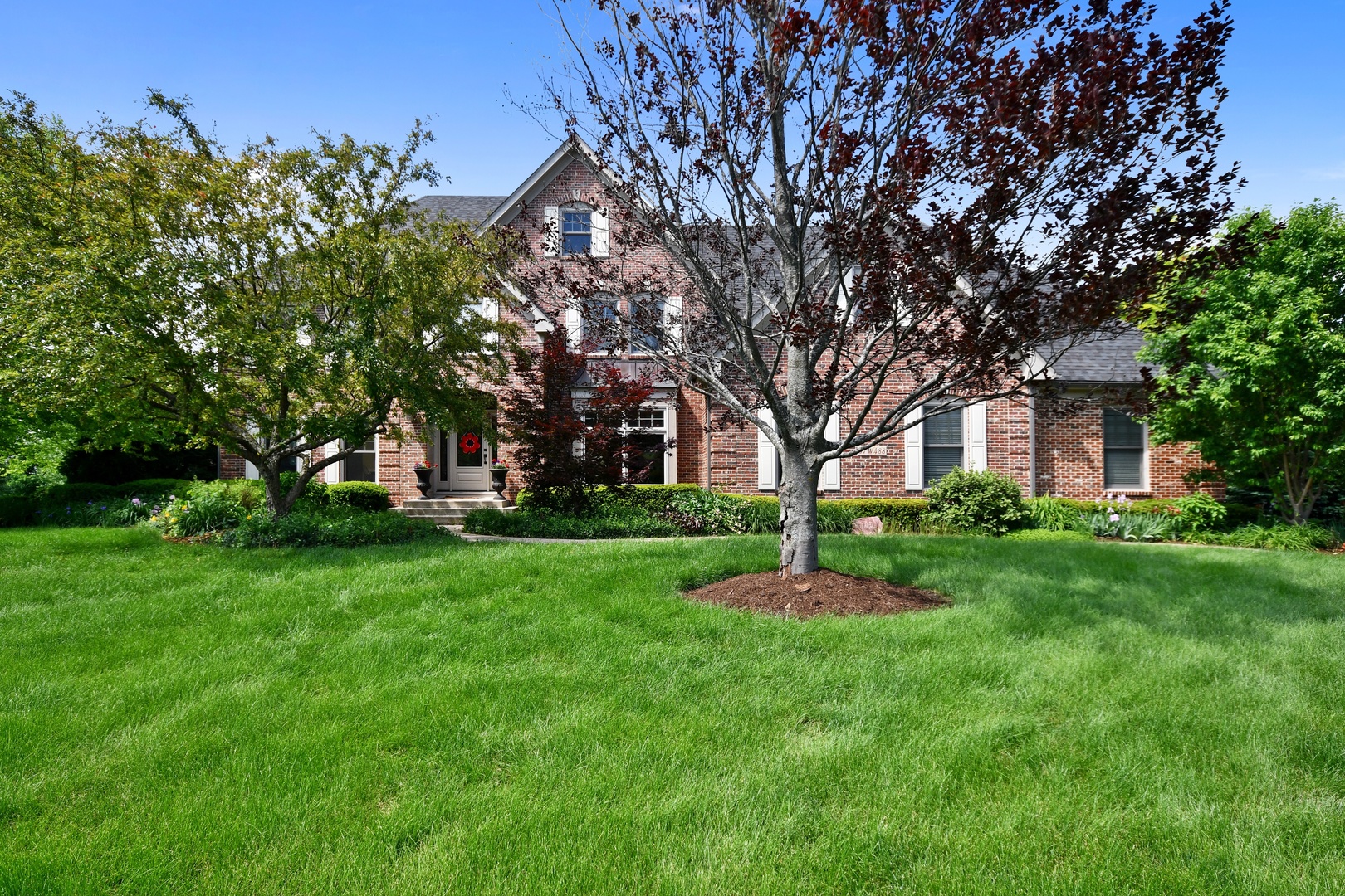 37W488 Grey Barn Road St. Charles, IL 60175 - Photo 1 of 25 a garden with trees in front of it
