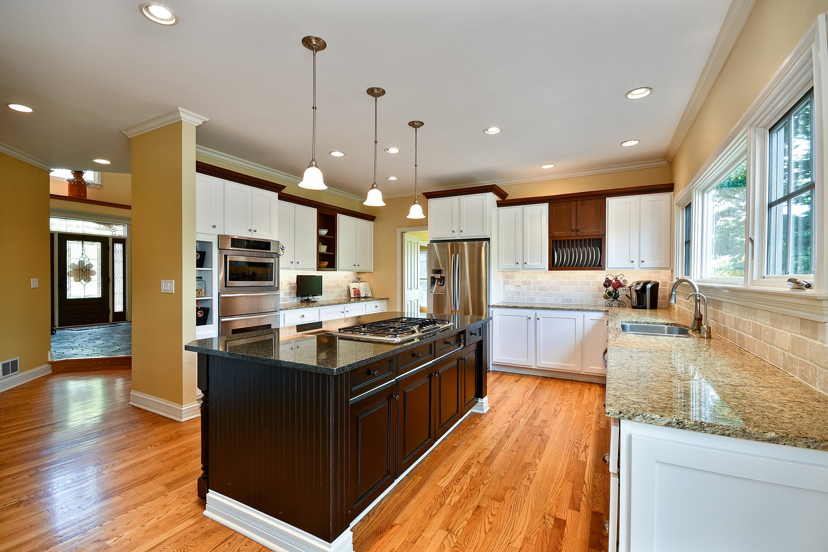 37W488 Grey Barn Road St. Charles, IL 60175 - Photo 6 of 25 a kitchen with stainless steel appliances granite countertop a stove and a refrigerator