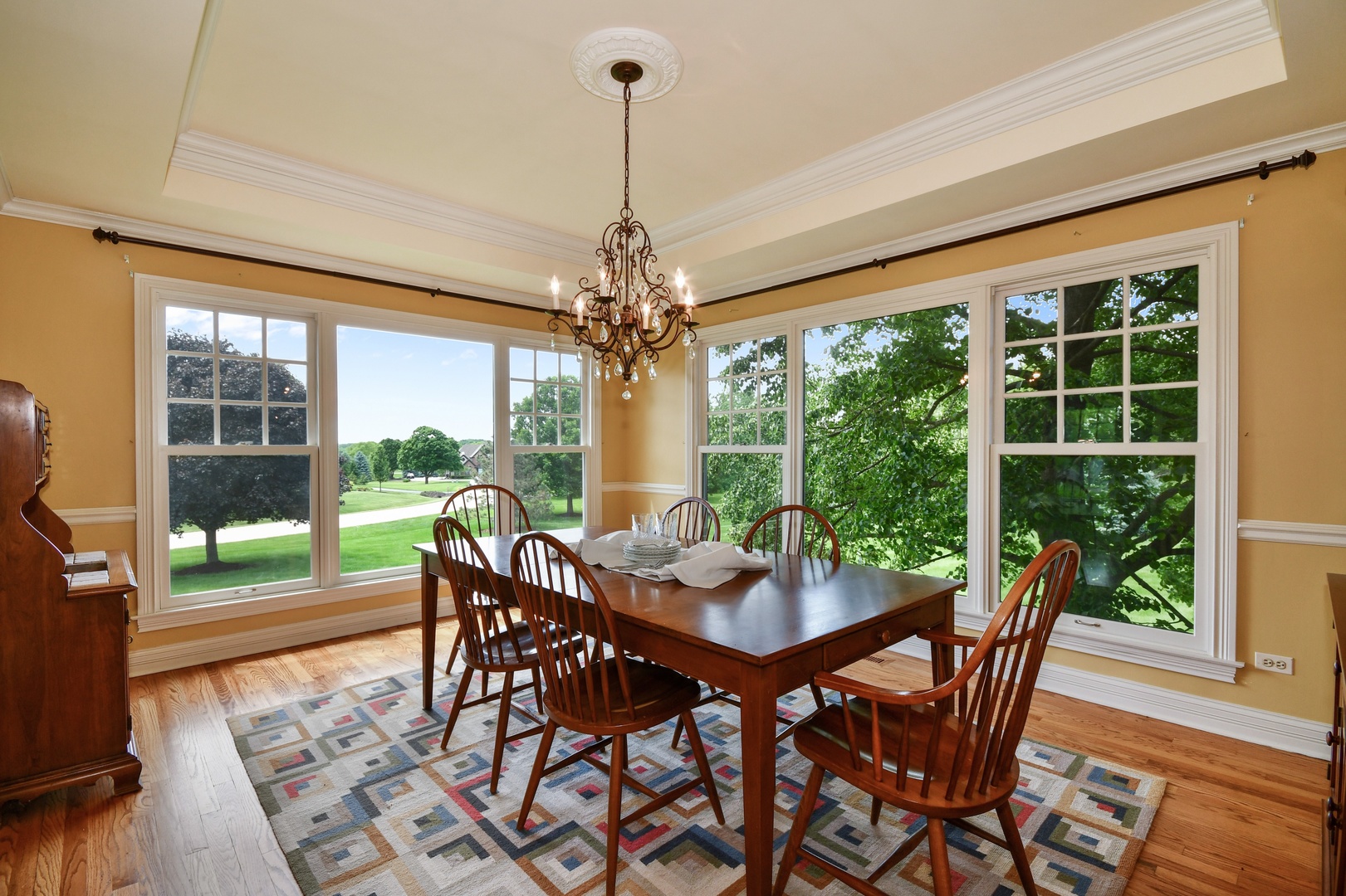 37W488 Grey Barn Road St. Charles, IL 60175 - Photo 7 of 25 a view of a dining room with furniture large windows and wooden floor