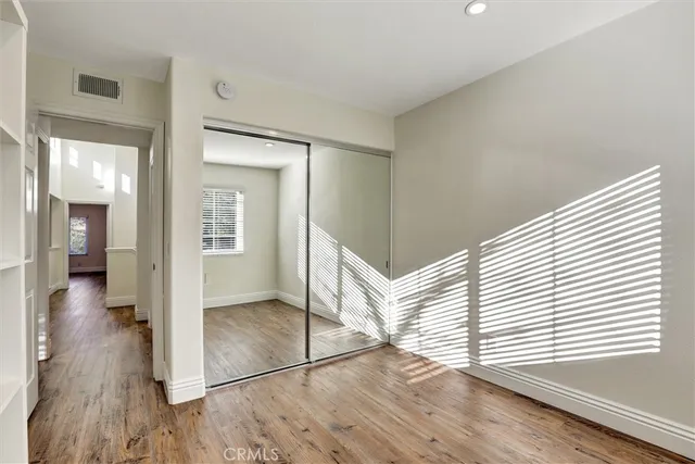 wooden floor in a hall with an entryway