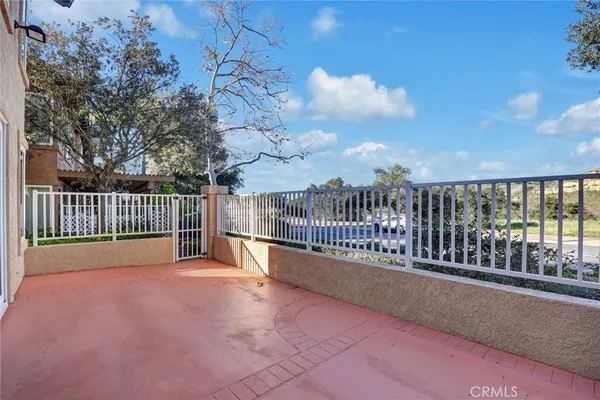 a view of balcony with wooden fence