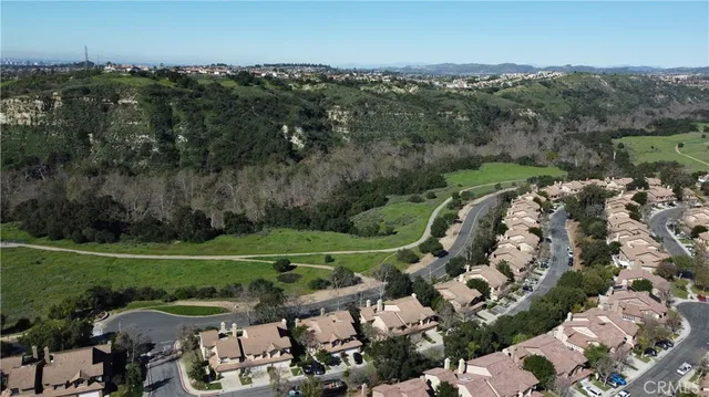 an aerial view of a golf course with parking space