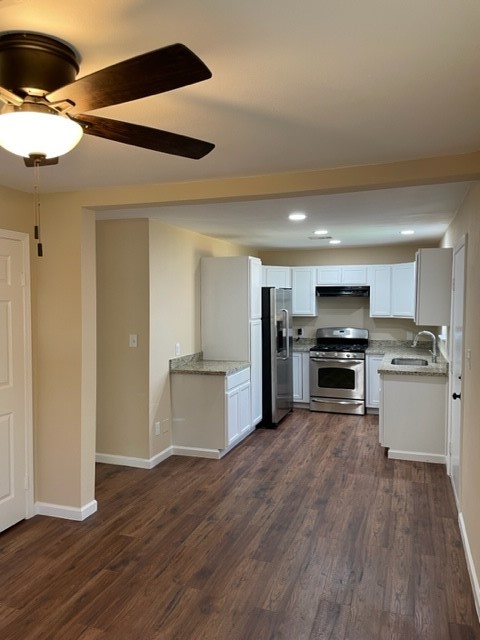 5603 Pickfair Street Houston, TX 77026 - Photo 15 of 22 a kitchen with a refrigerator and a stove top oven