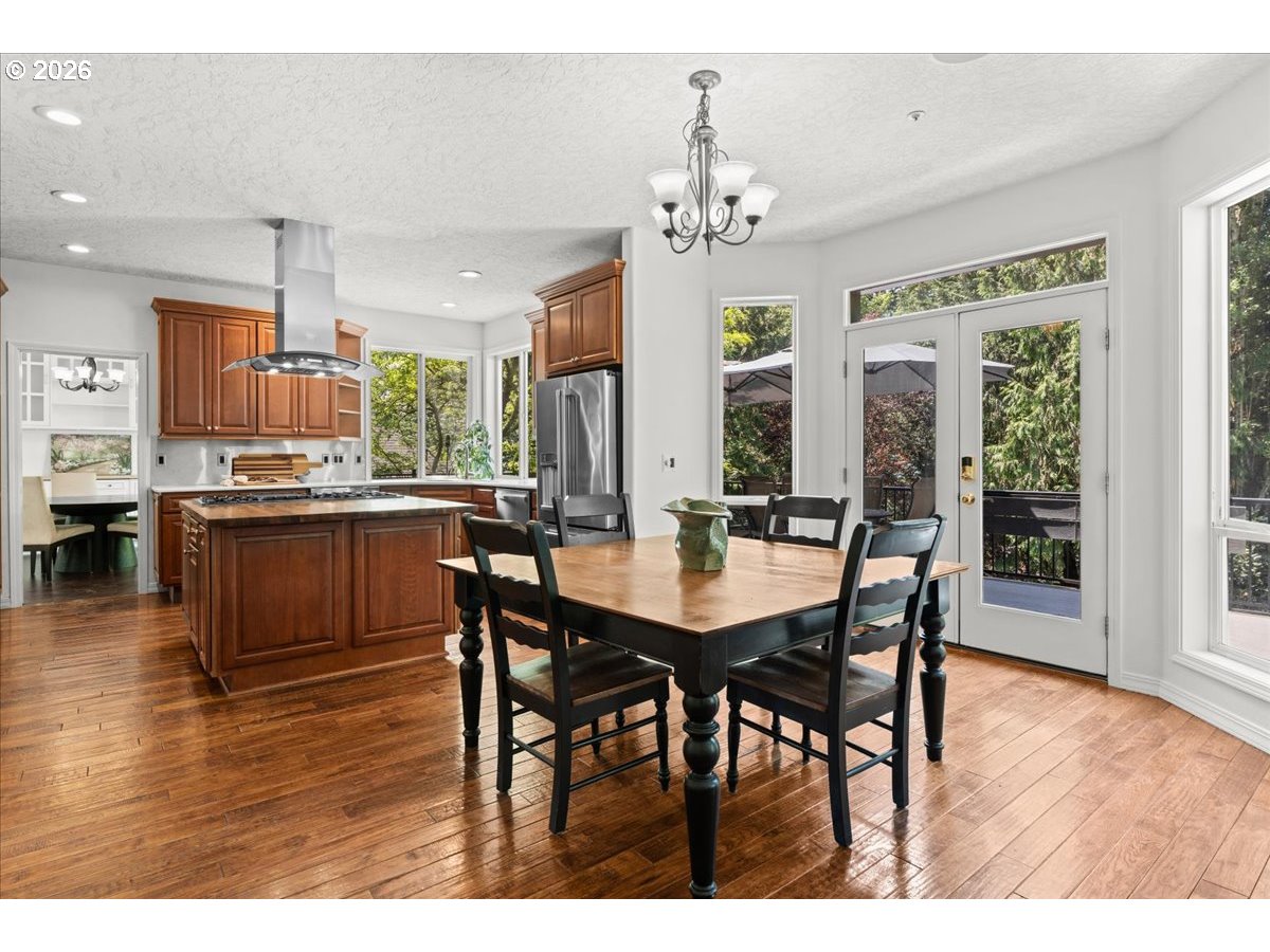 12431 Southwest 55th Place Portland, OR 97219 - Photo 8 of 40 a view of a dining room with furniture and wooden floor