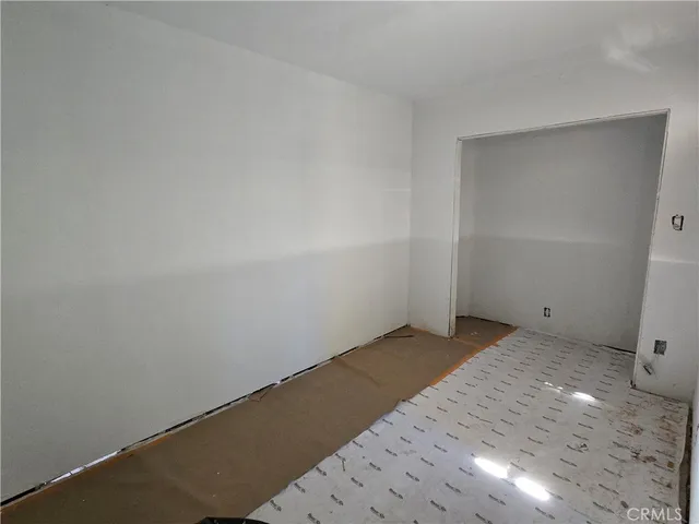 a view of walk in closet with clothes