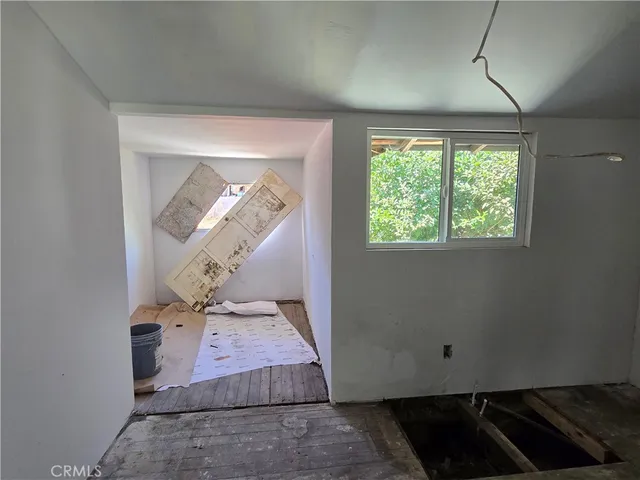 a view of a house with a snow in the background