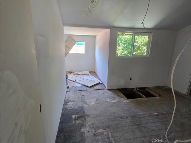 a view of a hallway view with staircase