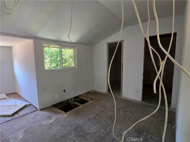 a kitchen with sink and cabinets